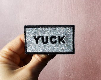 YUCK brooch silver sequined fabric sparkling rainbow embroidery English message outline black thread made in France