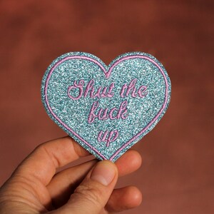 Heart brooch Shut the fuck up fabric sequins blue sky embroidery lilac thread message in English, made in France