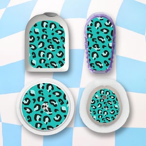 May include: Four different sized stickers with a teal and black leopard print design. The stickers are designed to cover medical devices.
