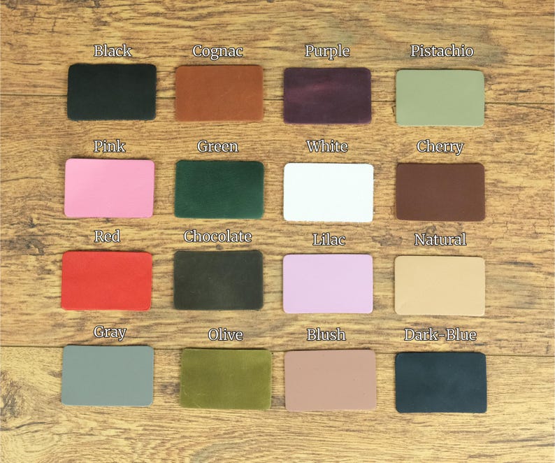 May include: A grid of sixteen rectangular leather swatches in various colors, each labeled with text including Black, Cognac, Purple, Pistachio, Pink, Green, White, Cherry, Red, Chocolate, Lilac, Natural, Gray, Olive, Blush, and Dark-Blue.