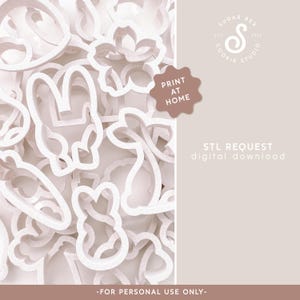 May include: A collection of white plastic cookie cutters in various shapes, including bunnies, flowers, and carrots. The image includes the text "PRINT AT HOME" and "STL REQUEST digital download".