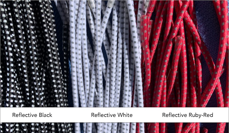 May include: Close-up of three bundles of reflective cords in black, white, and ruby-red. Each cord has a dotted pattern. Text at the bottom reads "Reflective Black", "Reflective White", and "Reflective Ruby-Red".