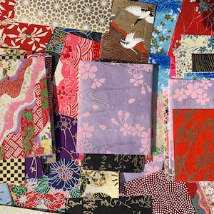 May include: Assortment of colorful Japanese washi paper sheets with various floral, geometric, and bird patterns. The paper is perfect for scrapbooking, card making, and other craft projects.