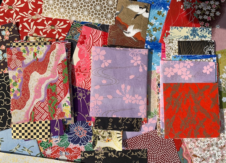 May include: Assortment of colorful Japanese washi paper sheets with various floral, geometric, and bird patterns. The paper is perfect for scrapbooking, card making, and other craft projects.