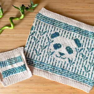 May include: Two knitted squares with a panda bear and bamboo design. The larger square features a panda bear face with bamboo stalks surrounding it. The smaller square has a geometric pattern of stripes and lines. Both squares are knitted in a cream color with green and blue accents.