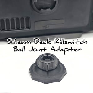 May include: Black plastic ball joint adapter for a Steam Deck killswitch. The adapter has a textured surface and a round knob on top.