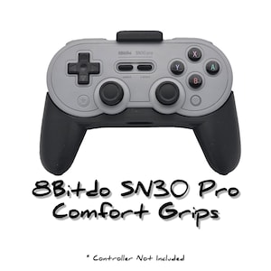 May include: A pair of grey and black 8Bitdo SN30 Pro comfort grips for a video game controller. The text "8Bitdo SN30 Pro Comfort Grips" is printed below the controller. The text "* Controller Not Included" is printed below the text.