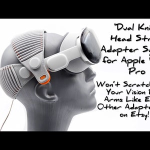 May include: A gray and orange head strap adapter system for Apple Vision Pro. The text "Dual Knit" is written above the image. The text "Won't Scratch/Ruin Your Vision Pro Arms Like Every Other Adapter set on Etsy!" is written below the image.