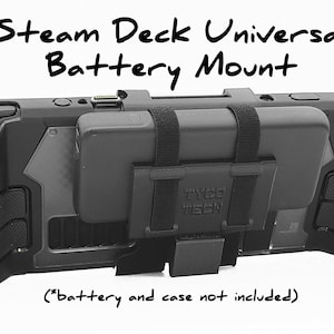 May include: Black Steam Deck Universal Battery Mount with velcro straps to attach a portable power bank. The text "TYCO TECH" is visible on the mount.  *(battery and case not included)*