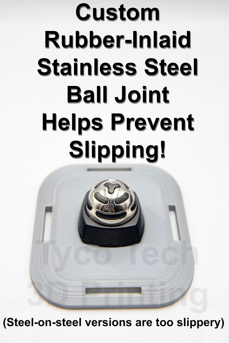 May include: A close-up of a silver ball joint with a black rubber inlay. The ball joint is mounted on a gray plastic base. The text "Custom Rubber-Inlaid Stainless Steel Ball Joint Helps Prevent Slipping!" is printed above the ball joint. The text "(Steel-on-steel versions are too slippery)" is printed below the ball joint.