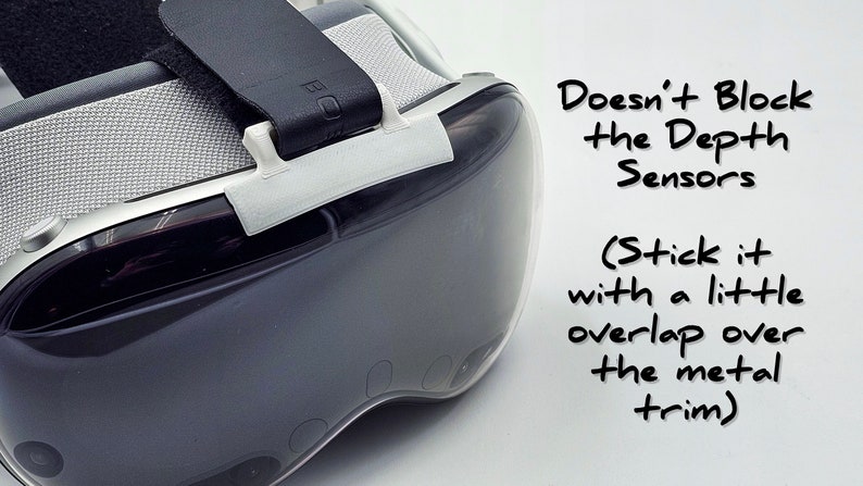 May include: A white plastic VR headset strap accessory with the text "Doesn't Block the Depth Sensors (Stick it with a little overlap over the metal trim)" written in black marker.