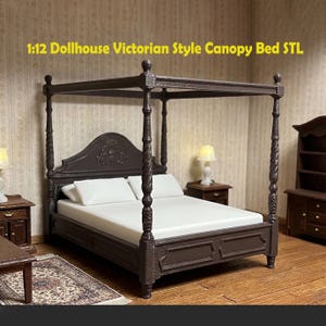 May include: A miniature Victorian-style canopy bed in dark brown, with a white mattress and pillows. The bed frame features ornate carvings and is part of a dollhouse set. The text "1:12 Dollhouse Victorian Style Canopy Bed STL" is displayed at the top.