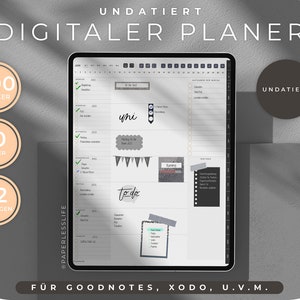 Könnte beinhalten: Ein digitaler Planer auf einem Tablet-Bildschirm mit einem grau-weißen Farbschema. Der Planer enthält 200 Sticker, 10 Cover und 32 Vorlagen. Der Planer ist kompatibel mit Goodnotes, Xodo und anderen Apps. Der Text "UNDATIERT" erscheint zweimal auf dem Bild.
