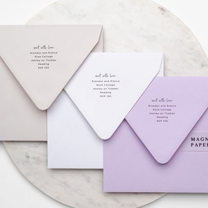 May include: Three square envelopes in different colours: light beige, white, and light purple. Each envelope has the same text printed on the front: "sent with love" followed by an address. The text "MAGNA PAPERS" is printed on a clear sticker on the purple envelope.
