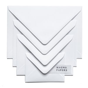 May include: A set of five white envelopes of different sizes, with the brand name "MAGNA PAPERS" printed on a label on the smallest envelope.