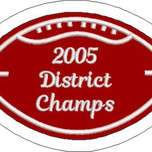 May include: Red and white embroidered patch shaped like a football with the text "2005 District Champs".
