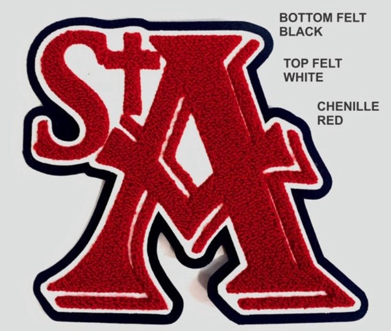 May include: A varsity-style letter patch featuring the letters StA in red chenille. The design includes a white felt middle layer and a black felt bottom layer. Text on the right side reads: BOTTOM FELT BLACK, TOP FELT WHITE, CHENILLE RED.