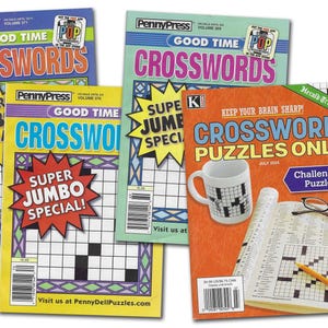 May include: Four crossword puzzle magazines with colorful covers. The magazines feature the words "Good Time Crosswords" and "Super Jumbo Special." One cover shows a mug with a crossword puzzle design.