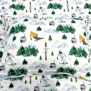 May include: White fabric with a repeating pattern of skiers, pine trees, and mountains. The pattern is in shades of green, blue, and yellow.