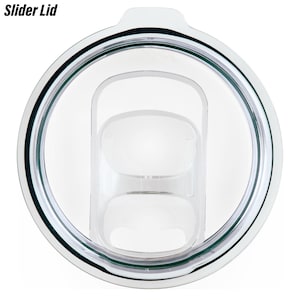 May include: Clear plastic slider lid for a tumbler. The lid has a silver rim and a green silicone seal.