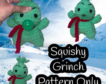 May include: Crocheted green Grinch doll with a red scarf and a green nose. The image shows three dolls, one held by a hand. The text "Squishy Grinch Pattern Only" is displayed in a black oval.