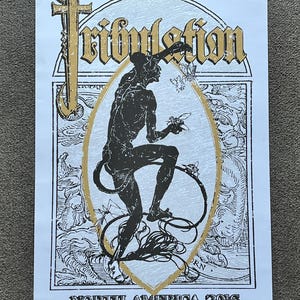 May include: A black and white poster with gold accents featuring a silhouette of a figure with a tail and wings. The poster has the text "Tribulation" in a gothic font and "North America 2016" at the bottom.