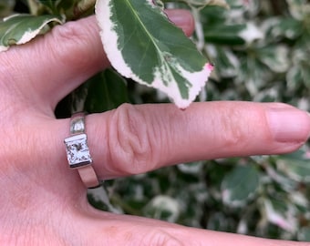 Vintage Fabulous quality Princess Cut Diamond ring in substantial platinum .This piece comes with qualified jeweler insurance valuation .