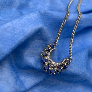 Vintage stunning sapphire and diamond Horseshoe 18 ct gold Pendant.