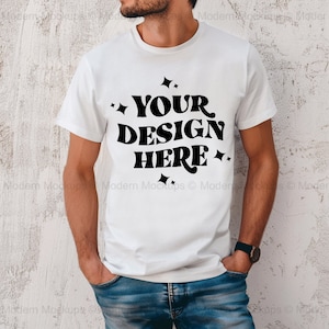 May include: A white t-shirt with a black graphic that says "YOUR DESIGN HERE" with small stars around the text.
