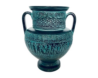 May include: A teal green ceramic amphora vase with a decorative design of Greek key patterns and figures. The vase has two handles and a round base.