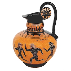 May include: A black and orange Greek pottery jug with a black handle and a star-shaped design on the top. The jug is decorated with black figures of three men running, and the inscription "ΔΡΟΜΕΙΣ" in Greek letters.