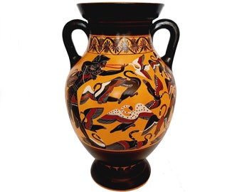 May include: Black and orange Greek amphora with a black figure painting of a woman with a bow and arrow hunting birds. The amphora has two handles and a round body.