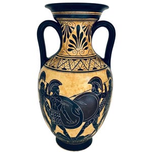 May include: Black and yellow Greek amphora with two handles and a black and white design of three warriors with shields and spears.