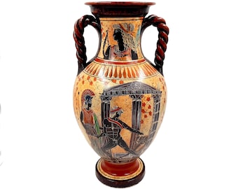 May include: A ceramic amphora with a black and white painted scene of a Greek myth. The amphora has a brown body with a red and orange painted design. The amphora has two twisted rope handles.