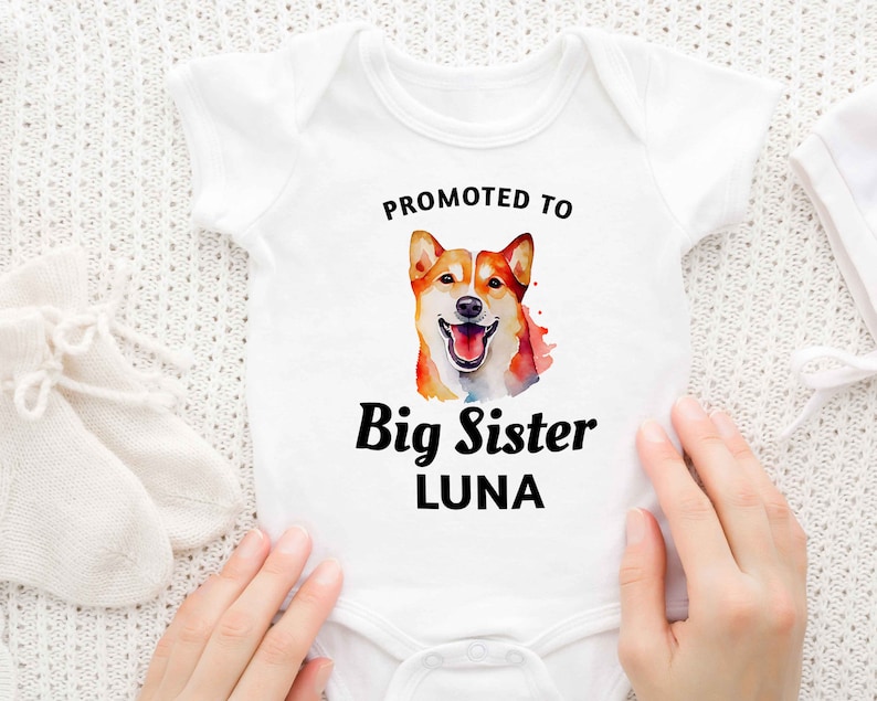 a baby bodysuit with a picture of a dog on it