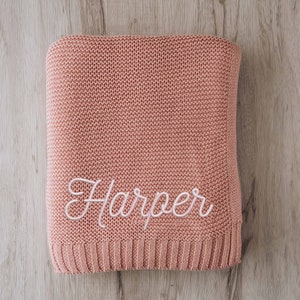 a pink sweater with the word harper written on it