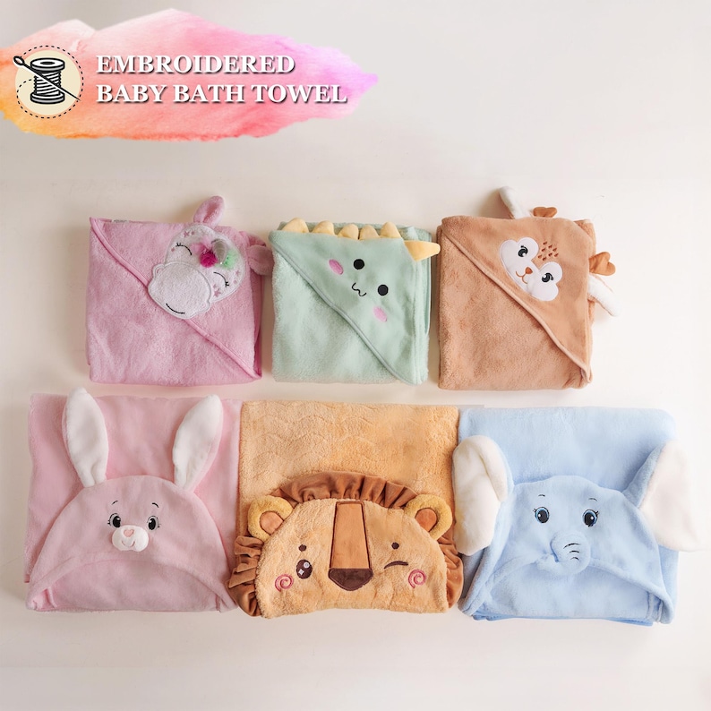a set of four baby bath towels with animals on them