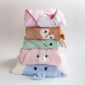 a stack of towels with different designs on them