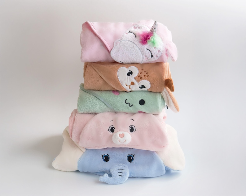 a stack of towels with different designs on them