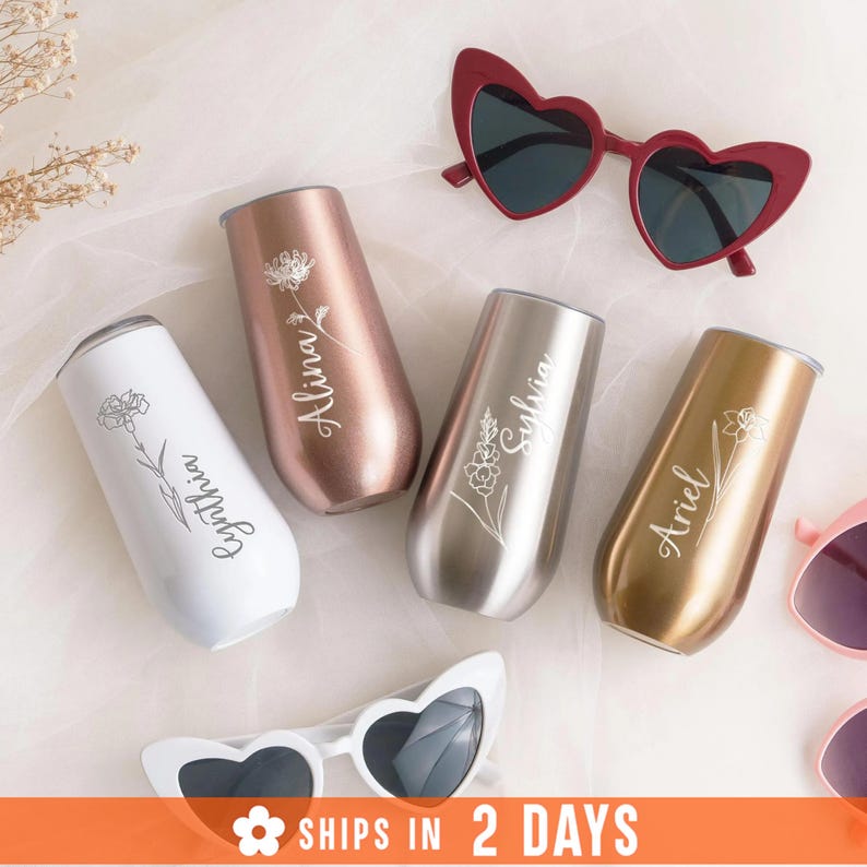 a collection of personalized items, including wine glasses, sunglasses, and a veil, arranged on a white background.