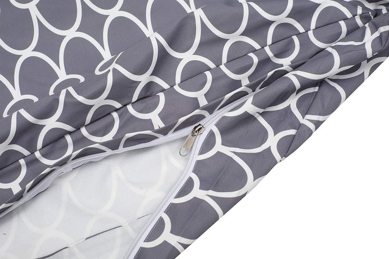 May include: A gray and white patterned fabric with a zipper. The fabric has a repeating pattern of white circles on a gray background.