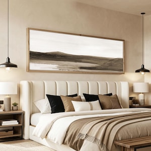May include: A horizontal rectangular wall art piece featuring an abstract landscape painting in shades of brown, beige, and white, enclosed in a light-toned wooden frame. The artwork depicts rolling hills and a flat horizon line in a minimalist style.