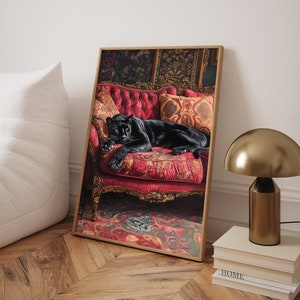 May include: A black panther is lying on a red velvet chaise lounge with gold accents. The chaise lounge is in a room with a patterned rug and ornate wallpaper.