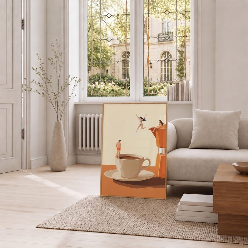 May include: A rectangular wall art print featuring a surreal illustration of a large coffee cup and a moka pot. Small figures are depicted jumping into and sitting on the coffee cup, set against a warm, muted background of cream and orange tones.