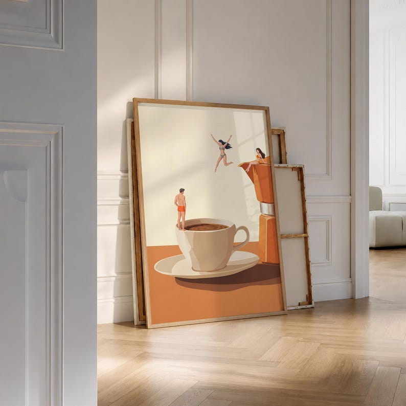 May include: A framed art print featuring a surreal scene with a large coffee cup on a saucer, a person in orange swim trunks standing on the rim, a person jumping in the air, and a person sitting on a large orange moka pot coffee maker.