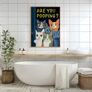 May include: A colorful illustration of six cats peeking around a door with the text "Are you pooping?" printed above them.