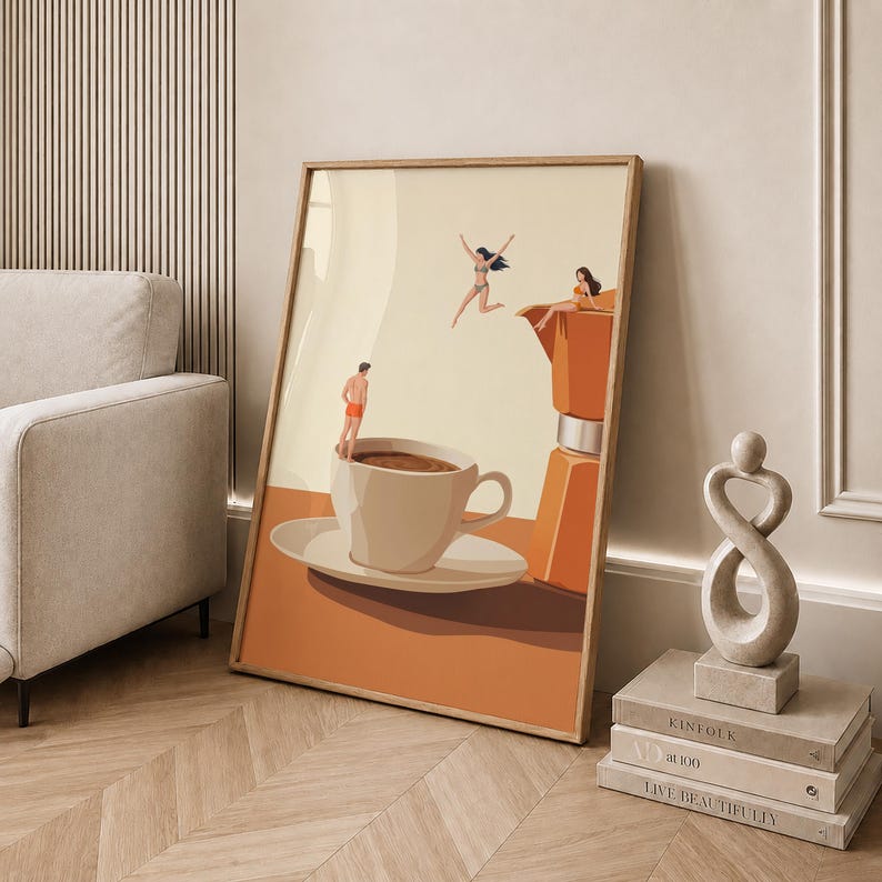 May include: A framed wall art print featuring a surreal illustration of a large coffee cup and a moka pot. Three small figures in swimwear are depicted interacting with the coffee vessels, with one person jumping and two others sitting.