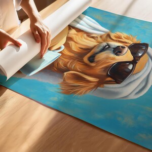 May include: A golden retriever dog wearing sunglasses and a white towel on its head. The dog is looking to the right and has a relaxed expression. The background is a light blue colour.