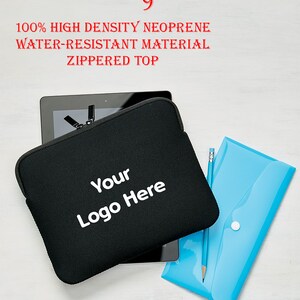May include: Black neoprene tablet sleeve, 9 inches, with a zippered top. The sleeve is water-resistant and features the text "Your Logo Here" in white. A blue pencil and a blue document holder are also in the image.