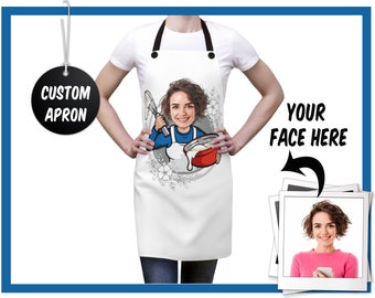 May include: White custom apron with a cartoon illustration of a person mixing ingredients in a red bowl. The apron has black straps and the text "CUSTOM APRON" on a black tag. The image also includes the text "YOUR FACE HERE".